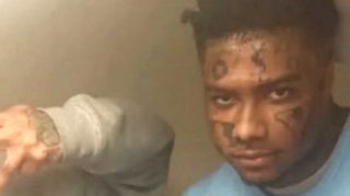 Image: Blueface Appears to Have New "YSL" Face Tattoo in Recently Surfaced Prison Photo